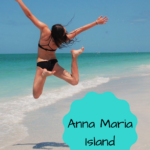 girl in a black bikini jumping happily on the beautiful beach