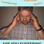 man holding his head with headache