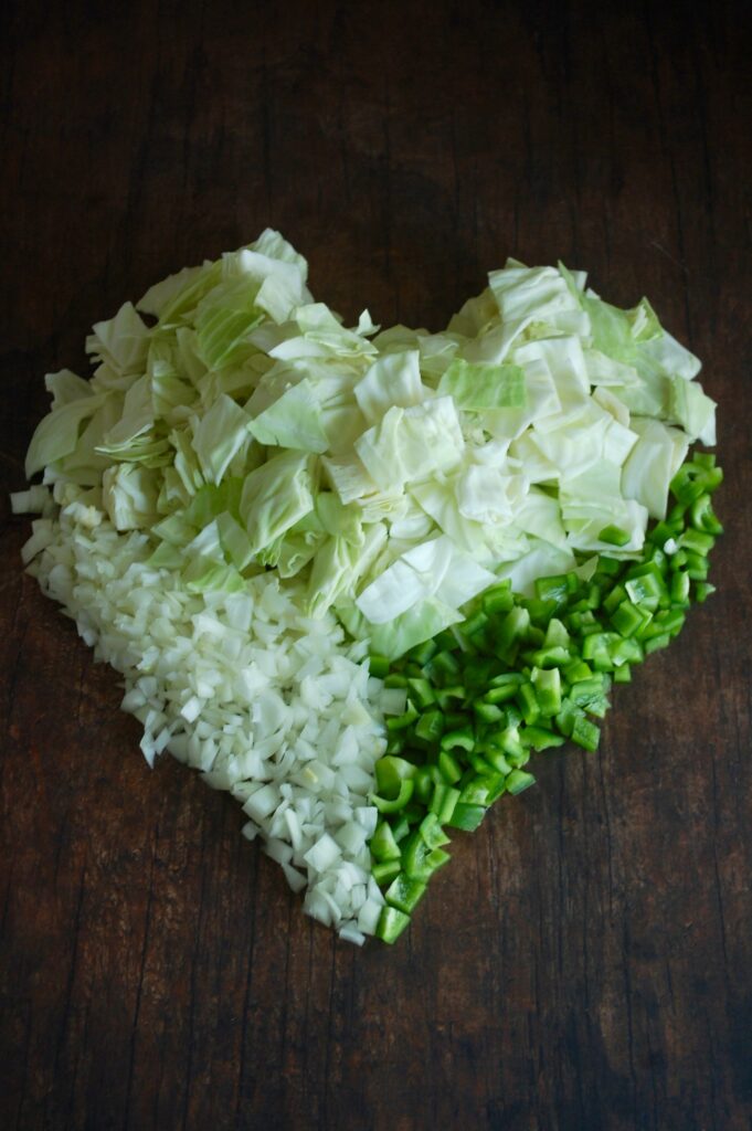 Chop onion, pepper, and cabbage shaped into a heart