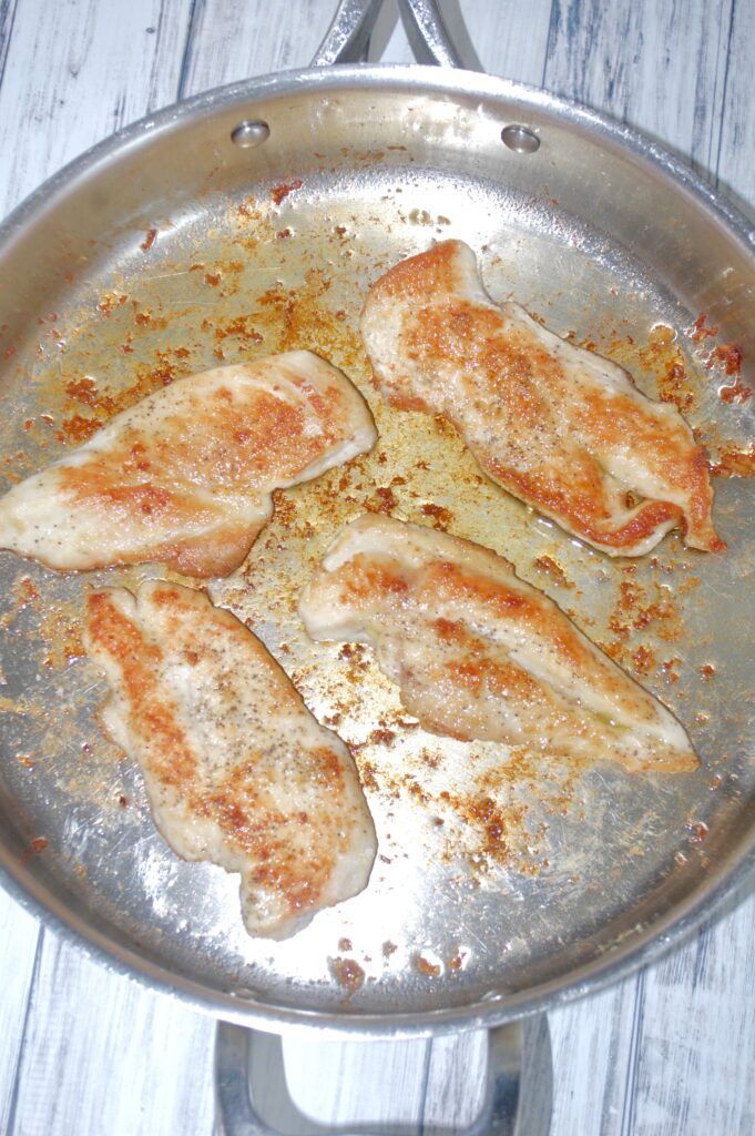 4 chicken breasts browned in a skillet