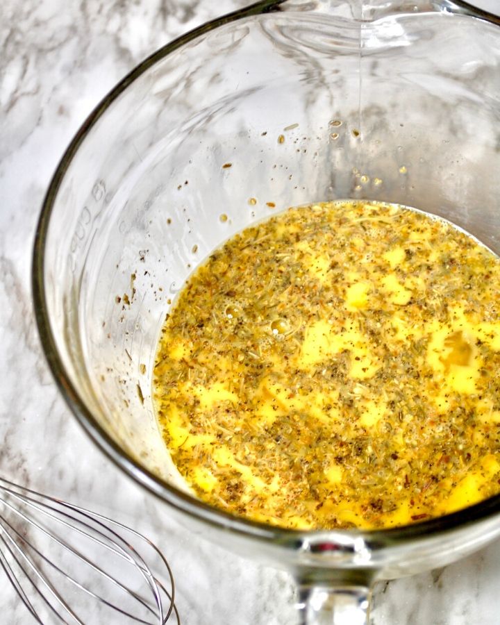 Egg mixture in a mixing bowl with a whisk