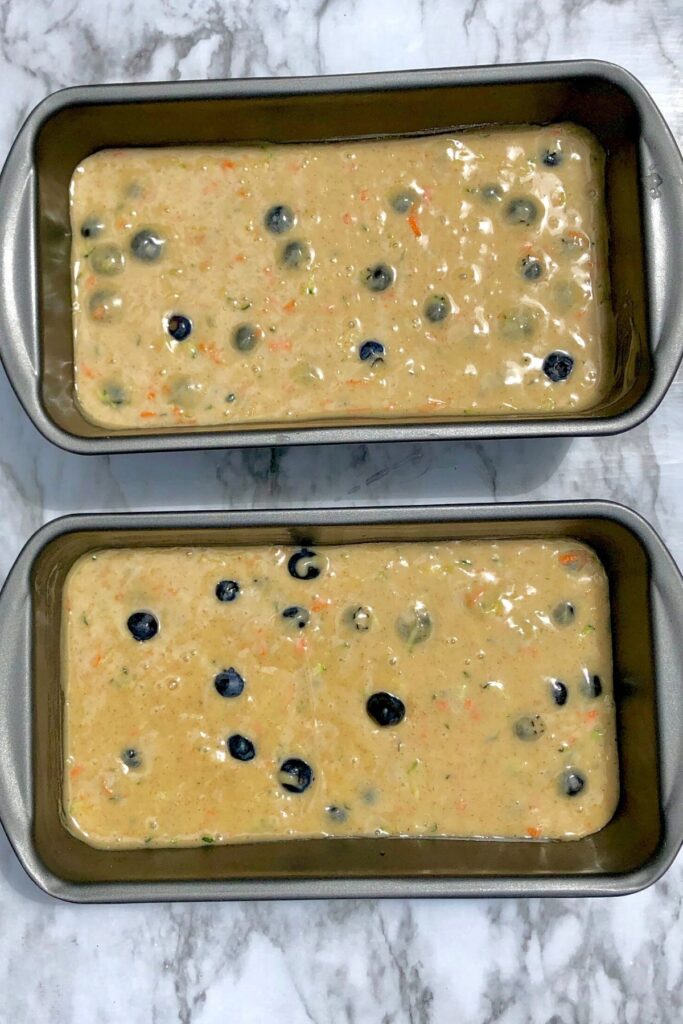 2 loaf pans full of blueberry zucchini batter