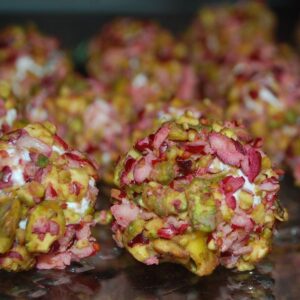 mini cheeseballs coated in chopped cranberries and pistachios