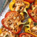 red, yellow, and orange stuffed peppers