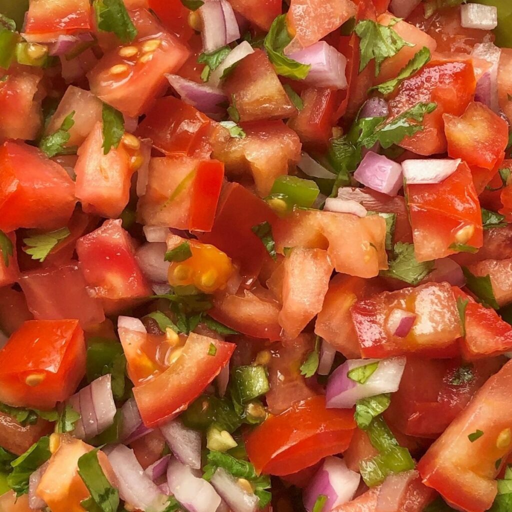 close up of pico de gallo with fresh tomato, red onion, cilantro, jalapeno