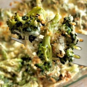broccoli cheese casserole close-up on a fork.