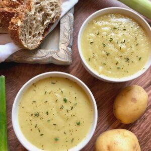 2 bowls of potato soup with crusty bread.