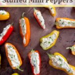 orange, red, and yellow mini peppers halved and stuffed with cream cheese.