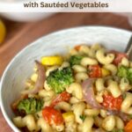 Cavatappi pasta tossed together with sauteed vegetables and tahini sauce.