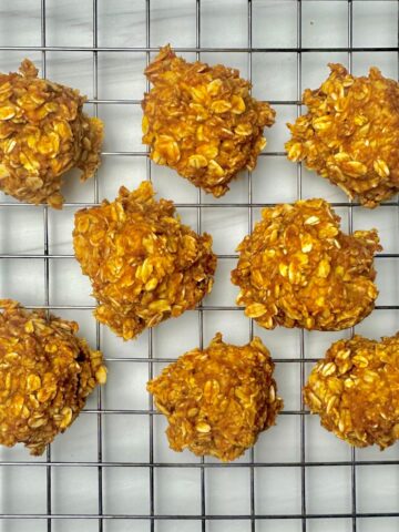 eight pumpkin spice cookies cooling on a wire rack
