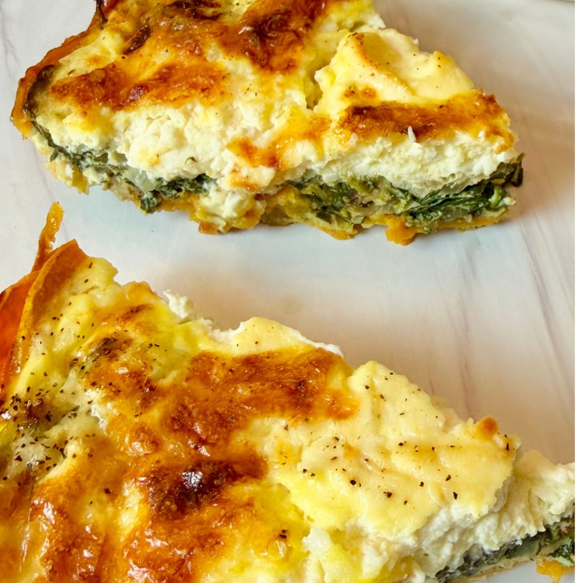 two slices of spinach ricotta quiche