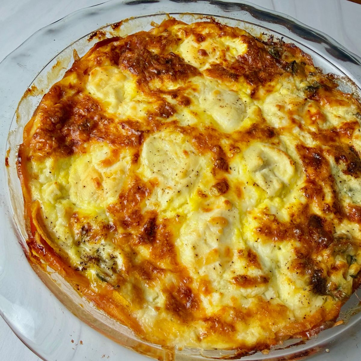 A cheesy quiche baked to golden perfection.